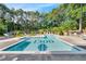 Community pool with surrounding lounge chairs at 1300 St Marys St # 404, Raleigh, NC 27605