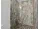 Large walk-in shower with modern gray tile at 1300 St Marys St # 404, Raleigh, NC 27605
