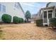 A level backyard with lawn and landscaped planting beds and shrubs at 1400 Basley St, Wake Forest, NC 27587