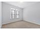 Well-lit bedroom with neutral walls and carpet at 1400 Basley St, Wake Forest, NC 27587