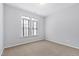 Neutral bedroom featuring neutral carpeting, natural light, and a blank canvas for customization at 1400 Basley St, Wake Forest, NC 27587