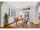 Cozy dining area featuring natural light, a pendant light, and access to a backyard patio at 1400 Basley St, Wake Forest, NC 27587