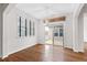 Open dining area with hardwood floors, a sliding glass door to the back patio, and a decorative light fixture at 1400 Basley St, Wake Forest, NC 27587