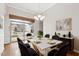 Dining room featuring modern decor, a chandelier, and a sliding door that provides access to the outside at 1400 Basley St, Wake Forest, NC 27587