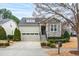 House exterior featuring stone accents and a two-car garage at 1400 Basley St, Wake Forest, NC 27587