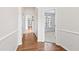 Bright hallway with hardwood floors and white trim at 1400 Basley St, Wake Forest, NC 27587