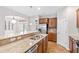 Well-designed kitchen area with island, sink, stainless steel appliances, and warm wood cabinets at 1400 Basley St, Wake Forest, NC 27587