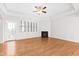 Open-concept living room featuring hardwood floors, a fireplace, and abundant natural light at 1400 Basley St, Wake Forest, NC 27587