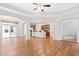 Bright, airy living space with hardwood floors, connecting kitchen, and access to the outdoors at 1400 Basley St, Wake Forest, NC 27587