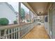 Screened porch with wood flooring and a view of the neighborhood at 1400 Basley St, Wake Forest, NC 27587