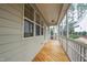 Enclosed porch with a wooden floor and views of the surrounding yard at 1400 Basley St, Wake Forest, NC 27587