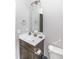 Single vanity bathroom with dark brown cabinets and a toilet at 16 Sourgum Ct Ct, Zebulon, NC 27597