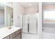 Bathroom showcases a soaking tub, shower, and modern vanity at 16 Sourgum Ct Ct, Zebulon, NC 27597