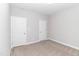 Simple bedroom with neutral walls, carpeting and two closets at 16 Sourgum Ct Ct, Zebulon, NC 27597