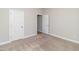 Spacious bedroom with neutral carpeting and an additional room at 16 Sourgum Ct Ct, Zebulon, NC 27597