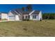 White and gray sided home with a two-car garage and landscaping at 16 Sourgum Ct Ct, Zebulon, NC 27597