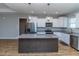 Large kitchen island with granite countertop and dark wood base at 16 Sourgum Ct Ct, Zebulon, NC 27597