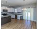 Eat-in kitchen with granite countertops, white cabinets, and island at 16 Sourgum Ct Ct, Zebulon, NC 27597