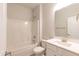 Clean bathroom featuring a shower-tub combo, a white vanity with chrome fixtures, and white walls at 1701 Drayton Hall Ln, Sanford, NC 27330