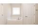 Clean bathroom featuring a soaking tub with tile surround at 1701 Drayton Hall Ln, Sanford, NC 27330