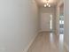 Hallway with wood flooring, light fixture, and a glimpse into the living area at 1701 Drayton Hall Ln, Sanford, NC 27330