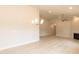Spacious living room with a fireplace, ceiling fan, recessed lighting and wood-look flooring at 1701 Drayton Hall Ln, Sanford, NC 27330