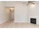 Bright living room with fireplace, wood-look floors, and recessed lighting at 1701 Drayton Hall Ln, Sanford, NC 27330