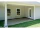 Covered patio with view of grassy backyard, siding, and white trim at 1701 Drayton Hall Ln, Sanford, NC 27330
