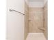 Tile shower featuring a built in seat and tiled accents at 1701 Drayton Hall Ln, Sanford, NC 27330