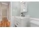 Modern bathroom with white vanity, black faucet, and white subway tile at 1712 Rosetta Dr, Durham, NC 27701