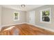 Simple bedroom with hardwood floors and neutral walls at 1712 Rosetta Dr, Durham, NC 27701