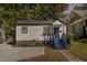 White house with blue steps, landscaping, and gravel at 1712 Rosetta Dr, Durham, NC 27701