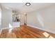 Hardwood floors, open concept living area with kitchen view at 1712 Rosetta Dr, Durham, NC 27701