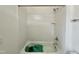 Bright white subway tile lines this tub and shower combo at 1725 Burnette Garden Path, Raleigh, NC 27612