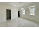 Bright bedroom featuring dormer windows and white trimwork at 1725 Burnette Garden Path, Raleigh, NC 27612