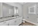 Clean bathroom with white vanity, granite countertop, and black fixtures at 201 Brickwell Way, Youngsville, NC 27596