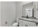 Modern bathroom with white vanity, granite countertop, and black matte fixtures at 201 Brickwell Way, Youngsville, NC 27596