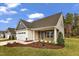 Newly constructed home with stone accents and a 2-car garage at 201 Brickwell Way, Youngsville, NC 27596