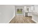 Modern kitchen with island and sliding door to backyard access at 201 Brickwell Way, Youngsville, NC 27596