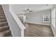 Bright living room with hardwood floors and a view of the kitchen at 201 Brickwell Way, Youngsville, NC 27596