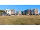 Aerial view of the apartment building and community green space at 2325 Gathering Square Ct Ct # 2325, Fuquay Varina, NC 27526
