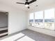 Bright bedroom with large windows, carpeting, and a ceiling fan at 2325 Gathering Square Ct Ct # 2325, Fuquay Varina, NC 27526