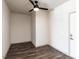 Spacious bedroom with dark gray vinyl plank flooring and ceiling fan at 2325 Gathering Square Ct Ct # 2325, Fuquay Varina, NC 27526