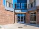 Modern building exterior with brick and blue accents at 2325 Gathering Square Ct Ct # 2325, Fuquay Varina, NC 27526