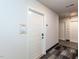 Clean and modern hallway with access to elevators and individual apartment units at 2325 Gathering Square Ct Ct # 2325, Fuquay Varina, NC 27526