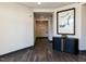 Stylish hallway with dark hardwood floors and modern artwork at 2325 Gathering Square Ct Ct # 2325, Fuquay Varina, NC 27526