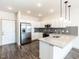 Modern kitchen with stainless steel appliances and granite countertops at 2325 Gathering Square Ct Ct # 2325, Fuquay Varina, NC 27526