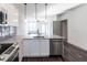 Modern kitchen features stainless steel appliances and granite countertops at 2325 Gathering Square Ct Ct # 2325, Fuquay Varina, NC 27526