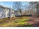 Spacious backyard with wooded area and partial fence at 2901 Alder Ridge Ln, Raleigh, NC 27603