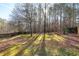 Private backyard with tall trees and shed at 2901 Alder Ridge Ln, Raleigh, NC 27603